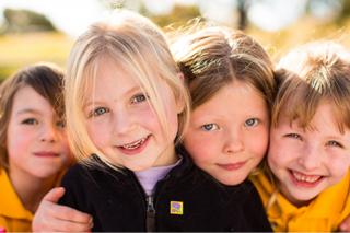 Four children smiling