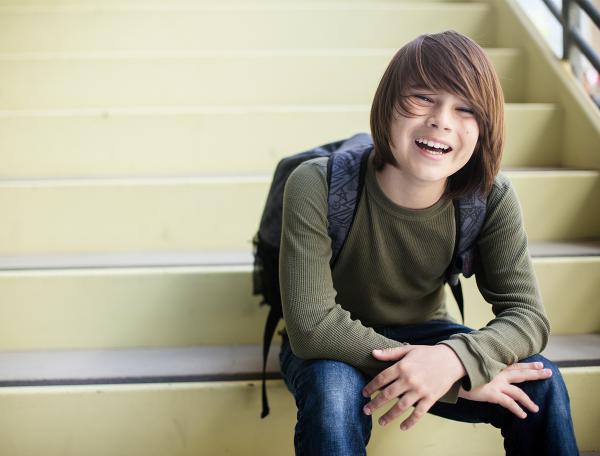 Teen sitting on stairs