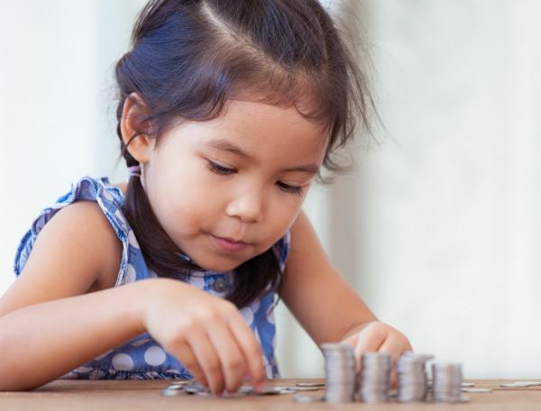 Girl playing with coins