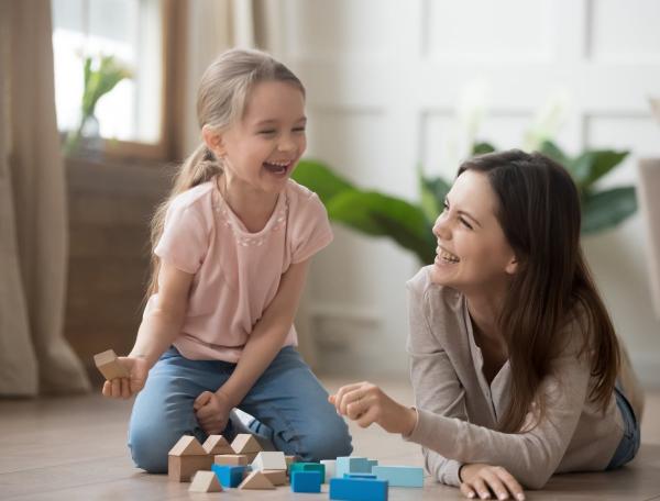 Mother and daughter playing with block shapes
